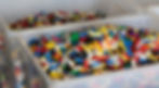 A large box filled with LEGO® bricks in the DD Bricks factory/warehouse.