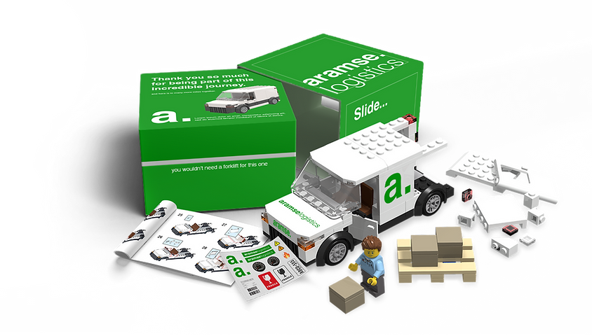 LEGO® delivery truck with Aramse Logistics branding, including instruction booklet and miniature figure for a realistic logistics-themed build.