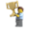 A LEGO minifigure with a golden trophy